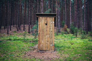 Outhouse in forest, Dziemiany commune of Cassubia region in Poland - obrazy, fototapety, plakaty