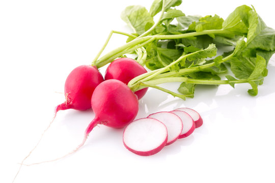 Bunch fresh radish with cutting out slice isolated.