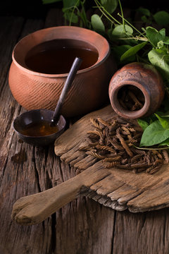 East Indian screw tree and Tea ,Thai herb for health on wooden background
