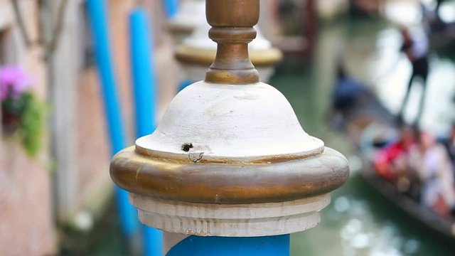Blue Striped Mooring Pole With Gondola And Gondolier In The Background In Venice, Italy - HD Video
