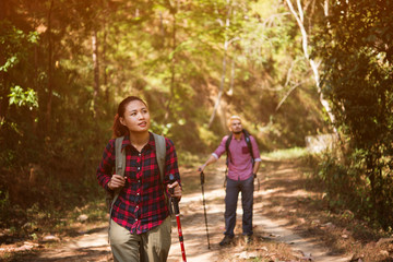 A hipster couple enjoying at hiking.