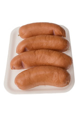 isolated plastic package with sausages on the white