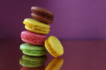 Macaroons on a violet background