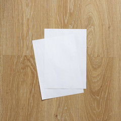 Blank sheet of paper on wooden background