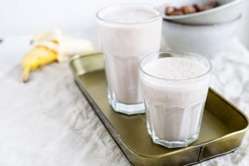 Banana smoothie with hazelnut milk. Vegan food concept