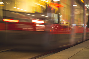 Fototapeta na wymiar : Tramway blurred motion. Public transport night scene. 