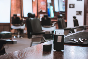 Barber shop equipment on wooden background.