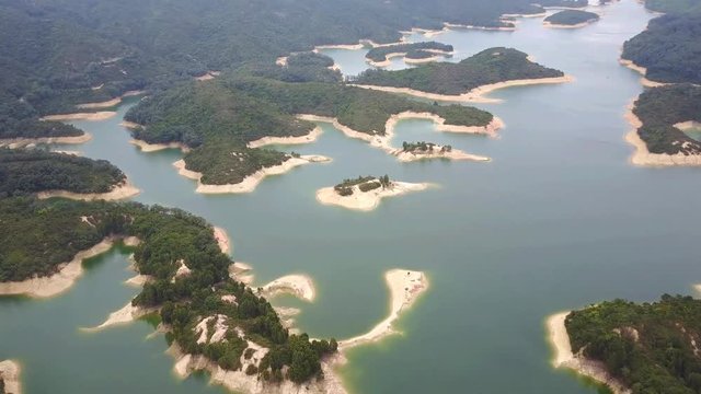 Aerial view over Hong Kong Tai Lam Chung Reservoir under smokey weather
