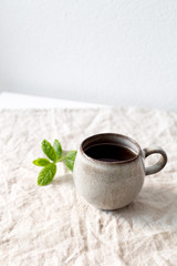 black tea with mint in old fashion rustic cup