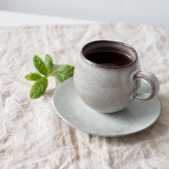 black tea with mint in old fashion rustic cup