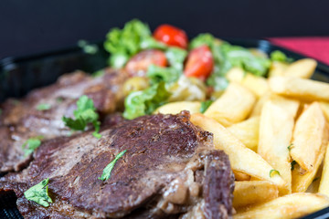 juicy steak beef meat with tomato and french fries