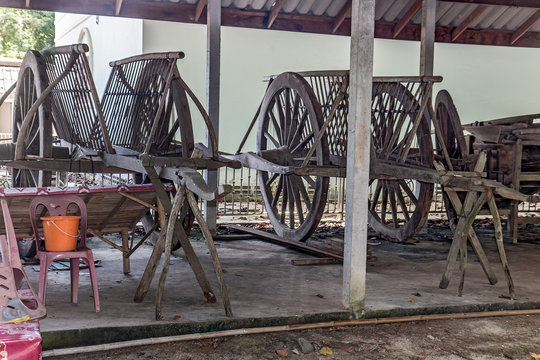 Traditional wooden carts parked under the porch on a farm, Nakhon Nayok, Thailand