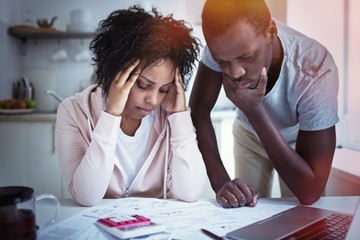 Young stressed african american couple in trouble, have no money to pay debts, to pay rent for...