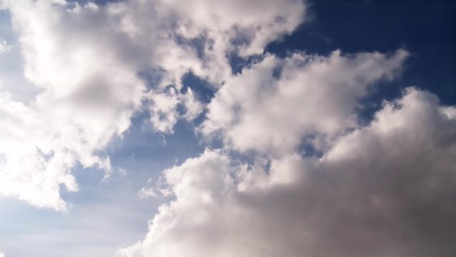 Timelapse of cumulus clouds forming on a clear blue sky