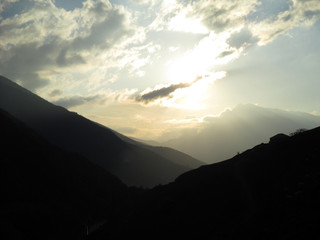 Obraz premium Russia, Caucasia, ingushetia. Silhouette of mountain on cloudy gray sky background, horizontal view.