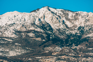 Mountains in Montenegro in the snow, near the coast. Budva. Lovcen.