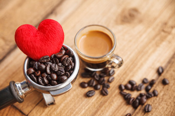 Coffee maker with red hearts symbol and coffee beans.
