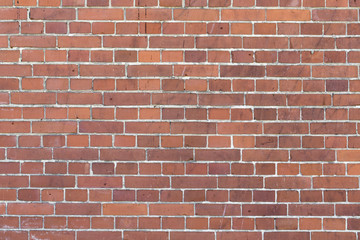 stained red brick wall for backgrounds