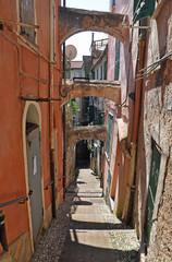 Fototapeta na wymiar Old street-stairs in San Remo, Italy
