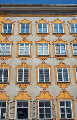 Facade of a building Salzburg, Austria. Typical facade with decorated windows of a building in Salzburg.