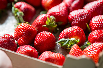 Fresh strawberries in wooden box
