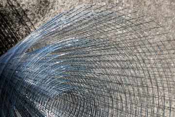 Fototapeta premium Roll loose shiny thin wire grating