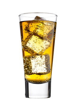 Glass of energy drink with bubbles and ice cubes