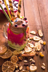 bright ice cream in a glass jar on a wooden background