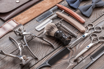 Fototapeta premium Vintage barber shop tools on wooden background