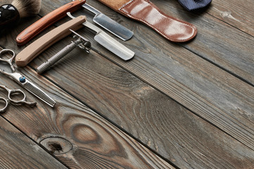 Vintage barber shop tools on wooden background