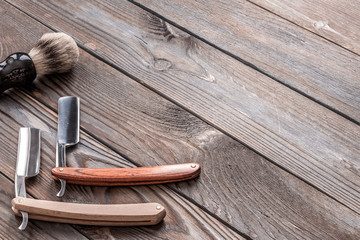 Fototapeta na wymiar Vintage barber shop tools on wooden background