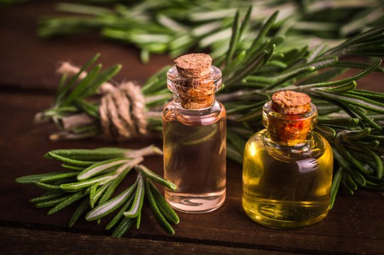 Rosemary essential oil in a glass bottle