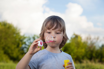 boy play in bubbles