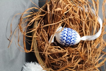 Painted Easter egg/ Easter egg and sheeps leather and straw.