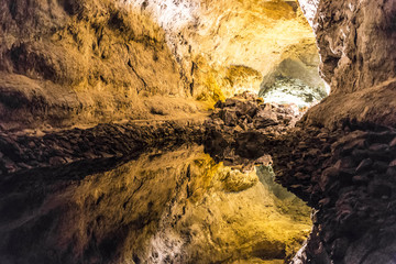 Fototapeta na wymiar Geological rock cave water reflection