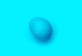 blue easter egg, isolated on blue background.