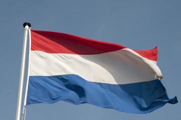 The Dutch red and white flag blowing in the wind