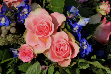 Pink roses and blue larkspur