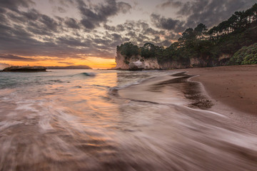 Sunrise at Cathedral cove with tidal surge