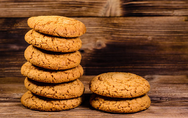 Stack of the oatmeal cookies on wooden table
