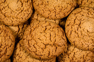 Stack of the oatmeal cookies on wooden table