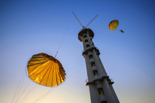 Jumping from a parachute tower. 