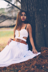 Portrait of beautiful wiccan girl in the forest