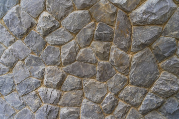 Rough stone of different shades, Stacked Stone Wall