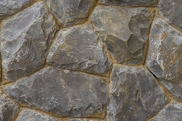 Rough stone of different shades, Stacked Stone Wall