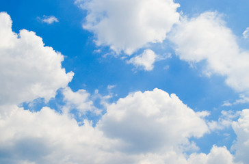 Fototapeta premium Blue sky with white and grey clouds.