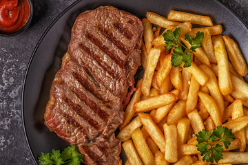 Beef barbecue steak with french fries.