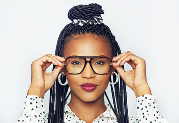 Black woman trying on glasses