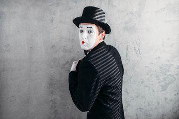 Male comedy artist posing, circus actor