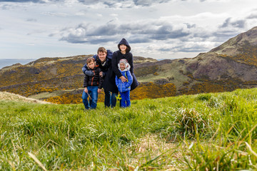 Family on Arthur's seat in Edinburgh, Scotland